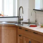 Stainless counter top with undermount sink.  Stainless joins with butcher block top for prep area.