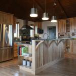 Birch kitchen with contrasting wood. Raised bar top with sink on island.