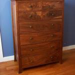 Figured walnut and mahogany dresser with dovetailed carcass.