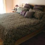 King size platform bed with curved headboard, oak.