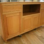 Cherry credenza for TV, Solid matched flush panels.