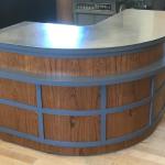 Reception desk for the Handwerker art gallery at Ithaca College.  Moder design play on mid-century modern.  Teak veneer, painted frame work and stainless top.