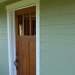 Solid cherry front door, one piece panels, dovetailed mullions.