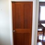 Cherry interior door with bookmatched panels and flame pattern.