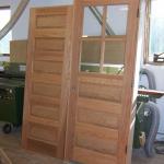Red oak doors built and stained to match existing woodwork.