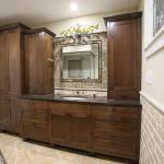 Black walnut vanity section and linen cabinet.  Hybrid style of inset and overlay cabinets.