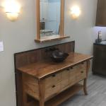 Furniture style vanity with cherry live edge counter and butternut panels/doors.  Butternut grain runs wraps cabinet.  