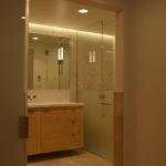 Bamboo bath vanity with inset fronts. Horizontal wood grain runs through cabinet.