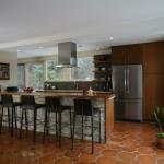 Teak, full overlay modern, solid teak bar top.  Design by Balance Studio.