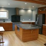 Teak cabinetry, horizontal grain. Soapstone and marble counters.