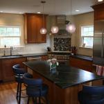 Cherry kitchen with natural lacquer finish, beaded inset doors, soapstone counters.