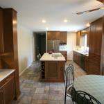 Stained cherry cabinets with corian counters.